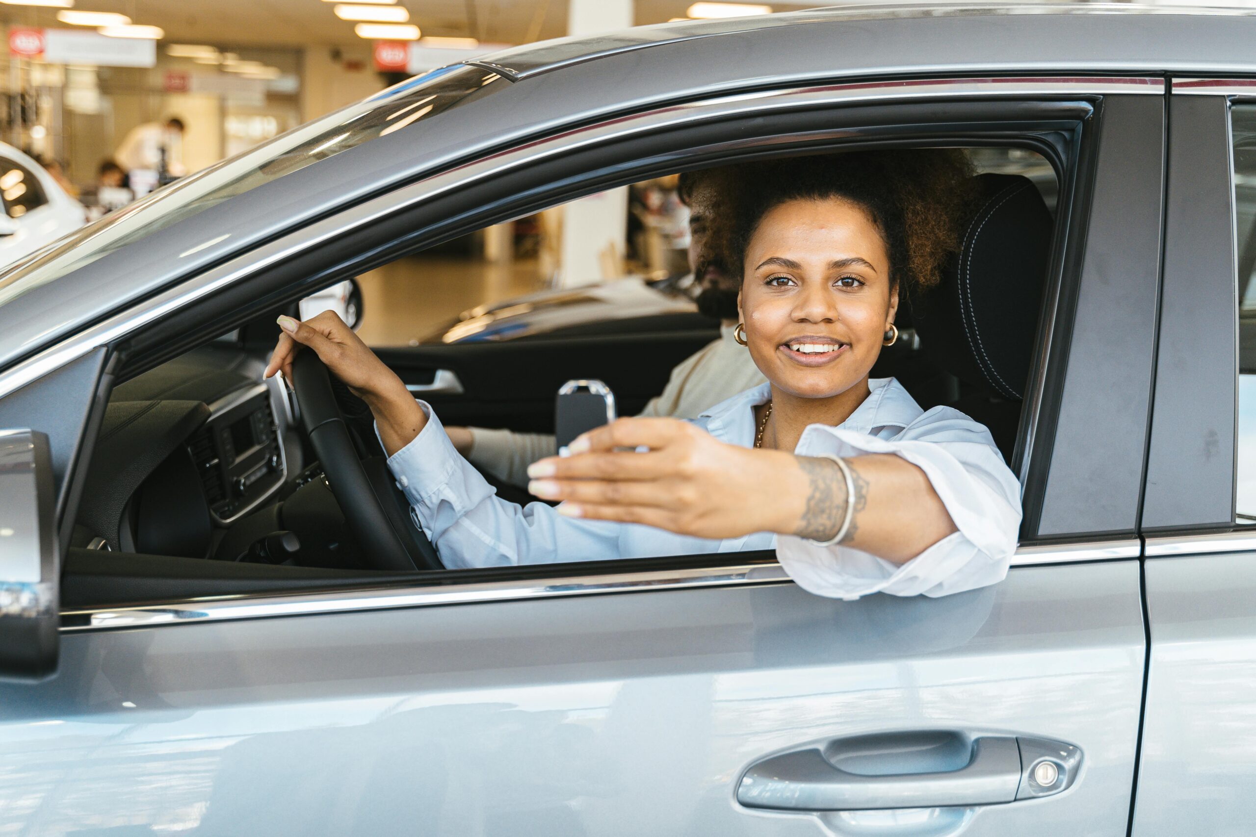 pexels-shkrabaanthony-7144213 Woman in a new car